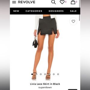 Never worn Revolve black mini skirt; Size Large